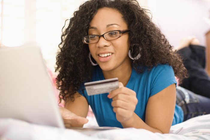Teenage girl shopping online